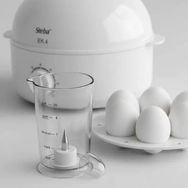 Close-up of a Steba EK 4 egg cooker, highlighting its measuring cup and egg piercer